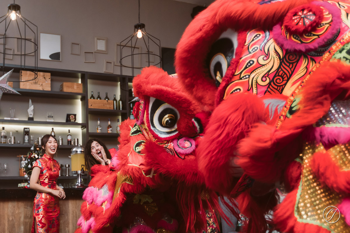 Funny couple posing with lion dance