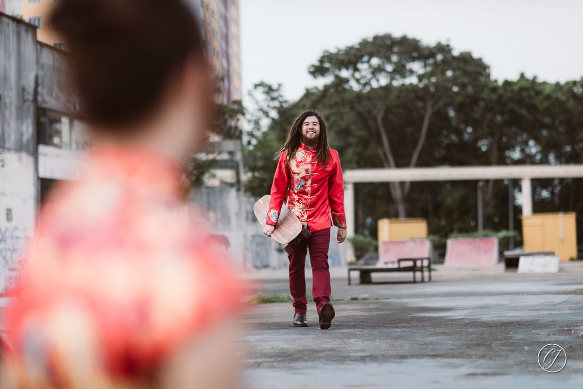 Justin surf-skating in his traditional Chinese wedding costume