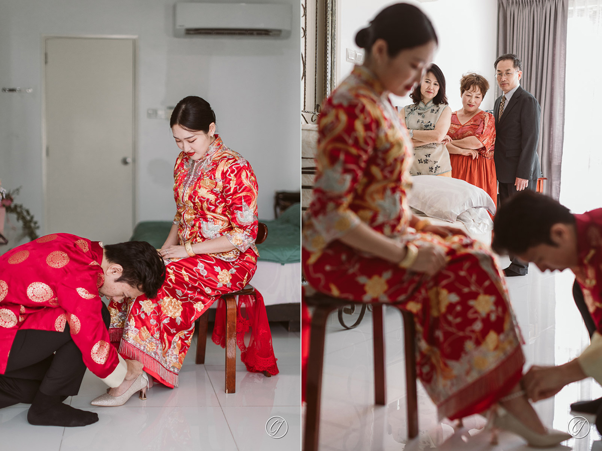 Groom helping bride to wear wedding heels
