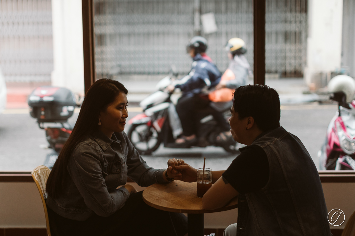Street scene of couple in cafe, AB Coffee Brewers