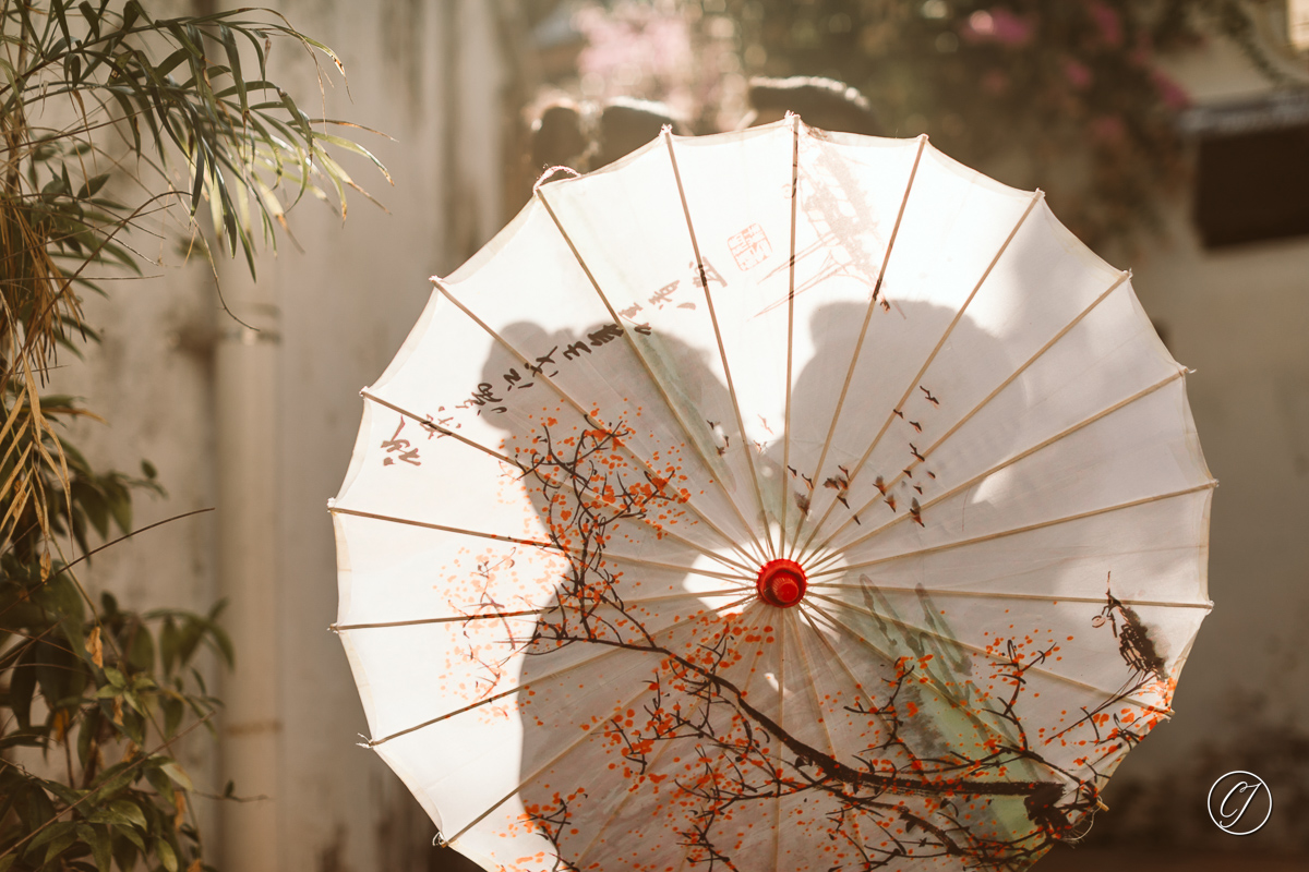 Silhouette shot of couple with Chinese umbrella