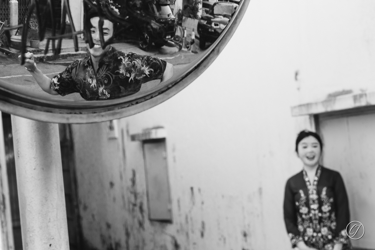 Street convex mirror with the playful couple