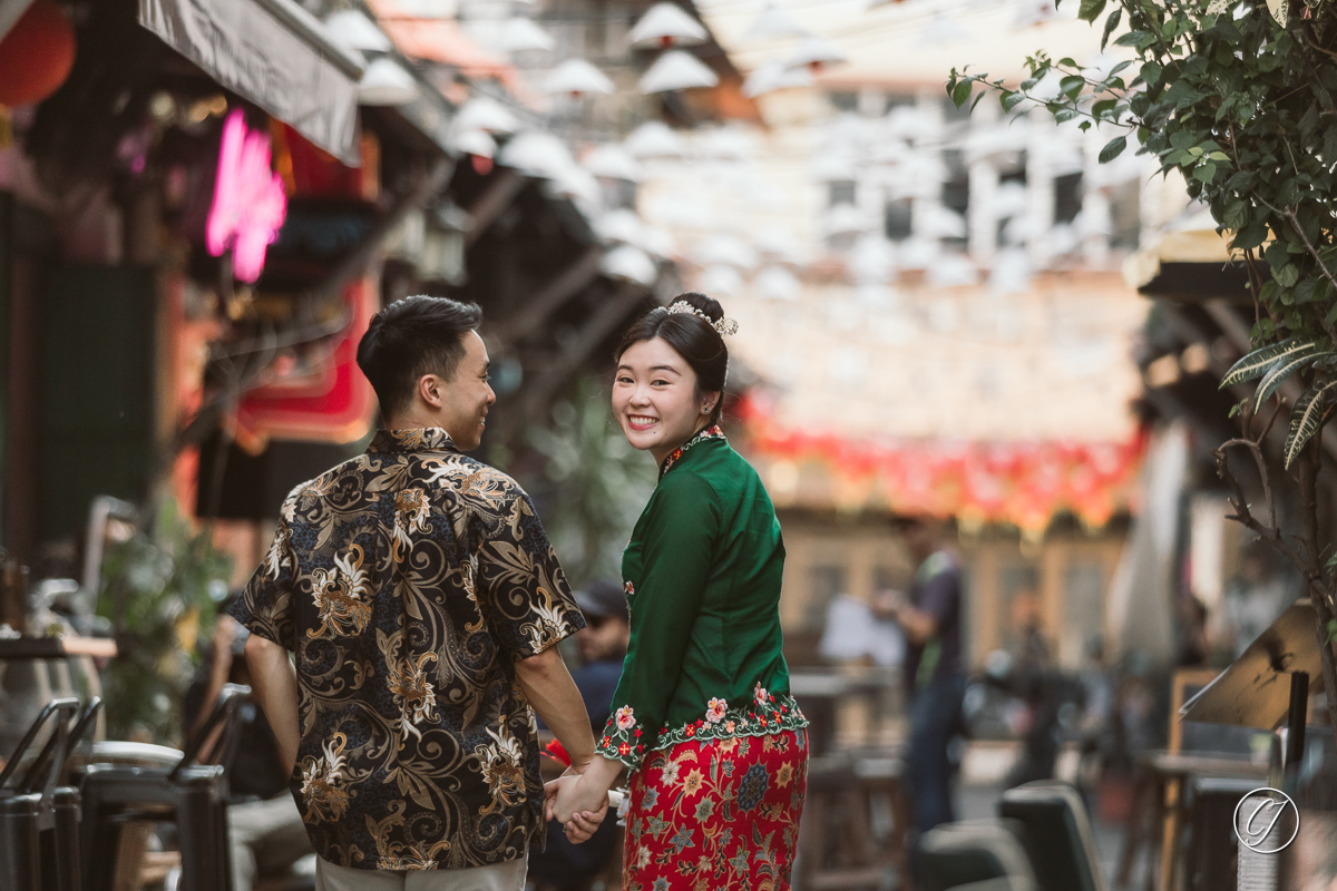 The Nyonya from Singapore, in Melaka, walking through Lorong Jambatan