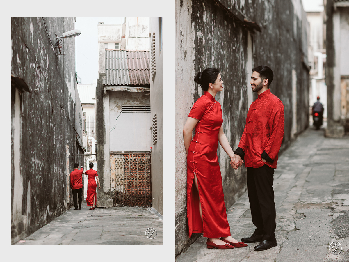 Couple in traditional Chinese outfits at the back alley of Melaka