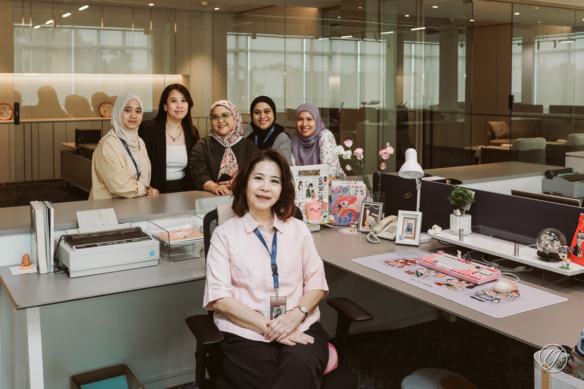 Some of team members at their new office table