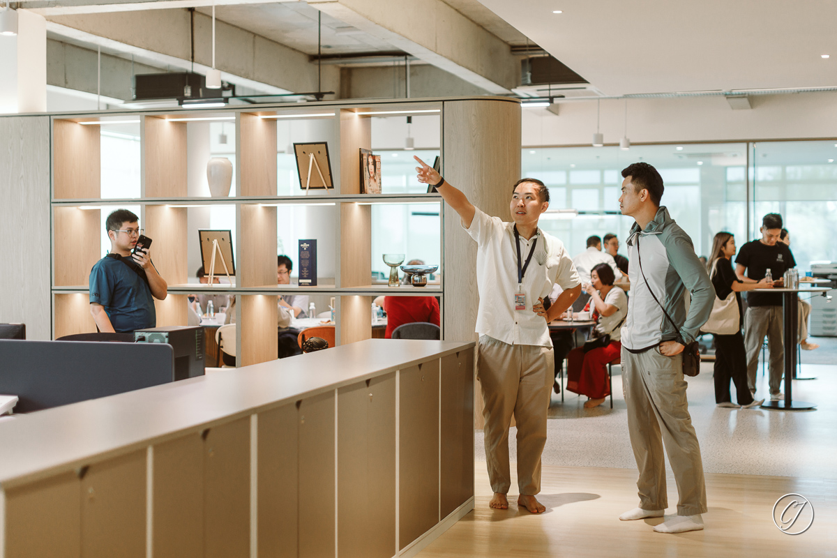 Mr. Yeow showing guest the interior